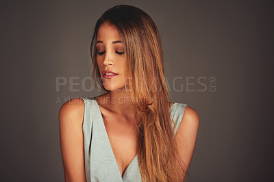 Buy stock photo Beauty, face and hair with young woman in studio on gray background for cosmetics or shampoo. Makeup, model and wellness with confident young person at salon for keratin haircare or treatment