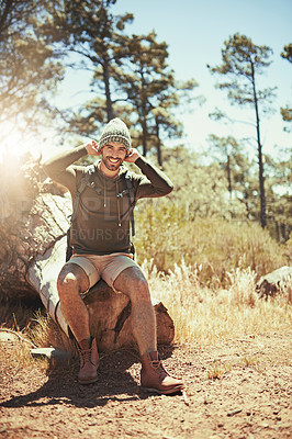 Buy stock photo Full length portrait of a young man taking a break while hiking