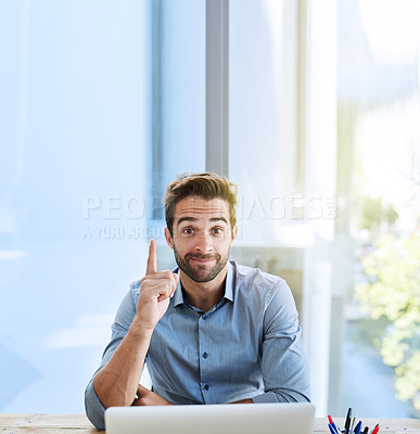 Buy stock photo Shot of a handsome young businessman in the office