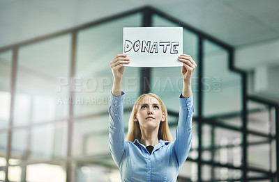Buy stock photo Donation, charity and fundraiser while holding a placard and asking for help and support in corporate office. Business woman and charitable foundation volunteer asking for assistance from community