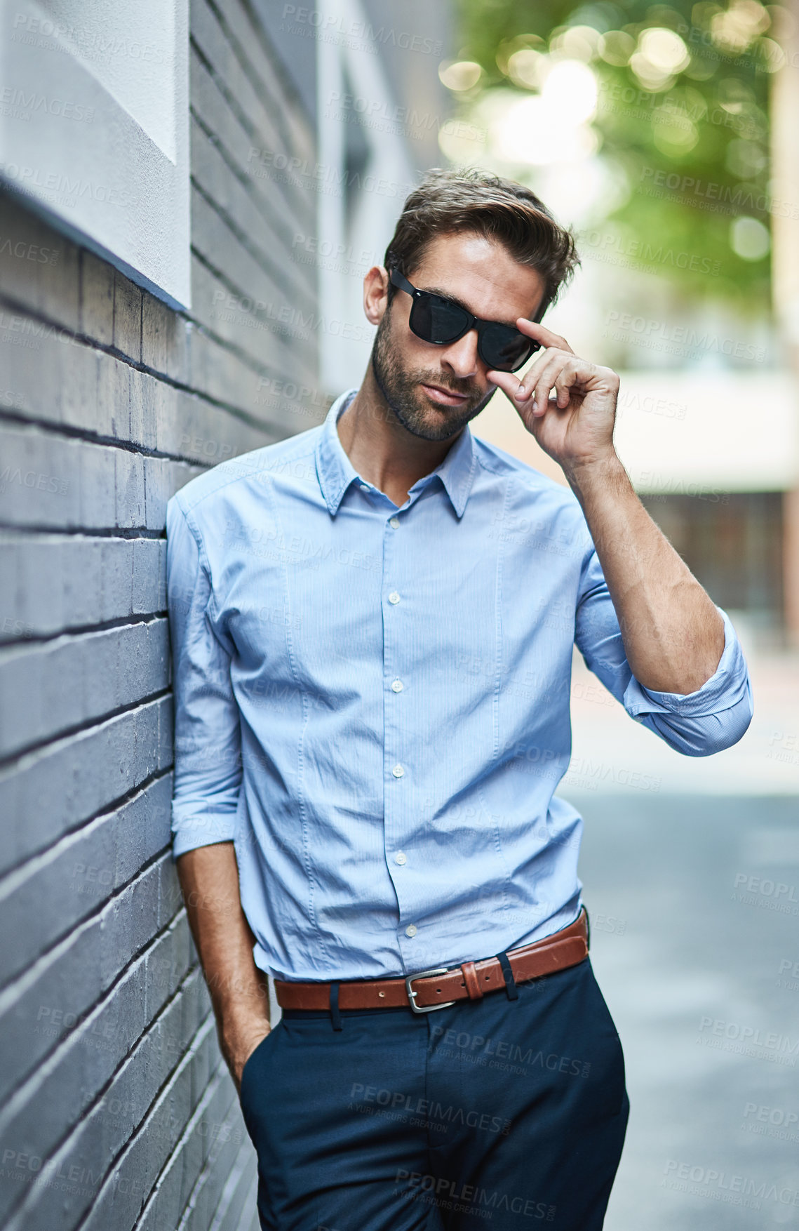 Buy stock photo Businessman, pride and sunglasses in urban area for fashion, sunglasses and designer brand. Male person, working and executive in city for creative company, outfit and eyewear style in street.