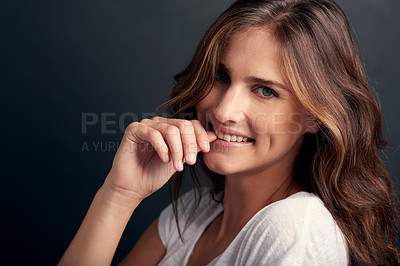 Buy stock photo Happy woman, portrait and hair with natural beauty for style, care or flirt on a dark studio background. Face of female person or brunette with smile and wavy hairstyle in satisfaction for grooming