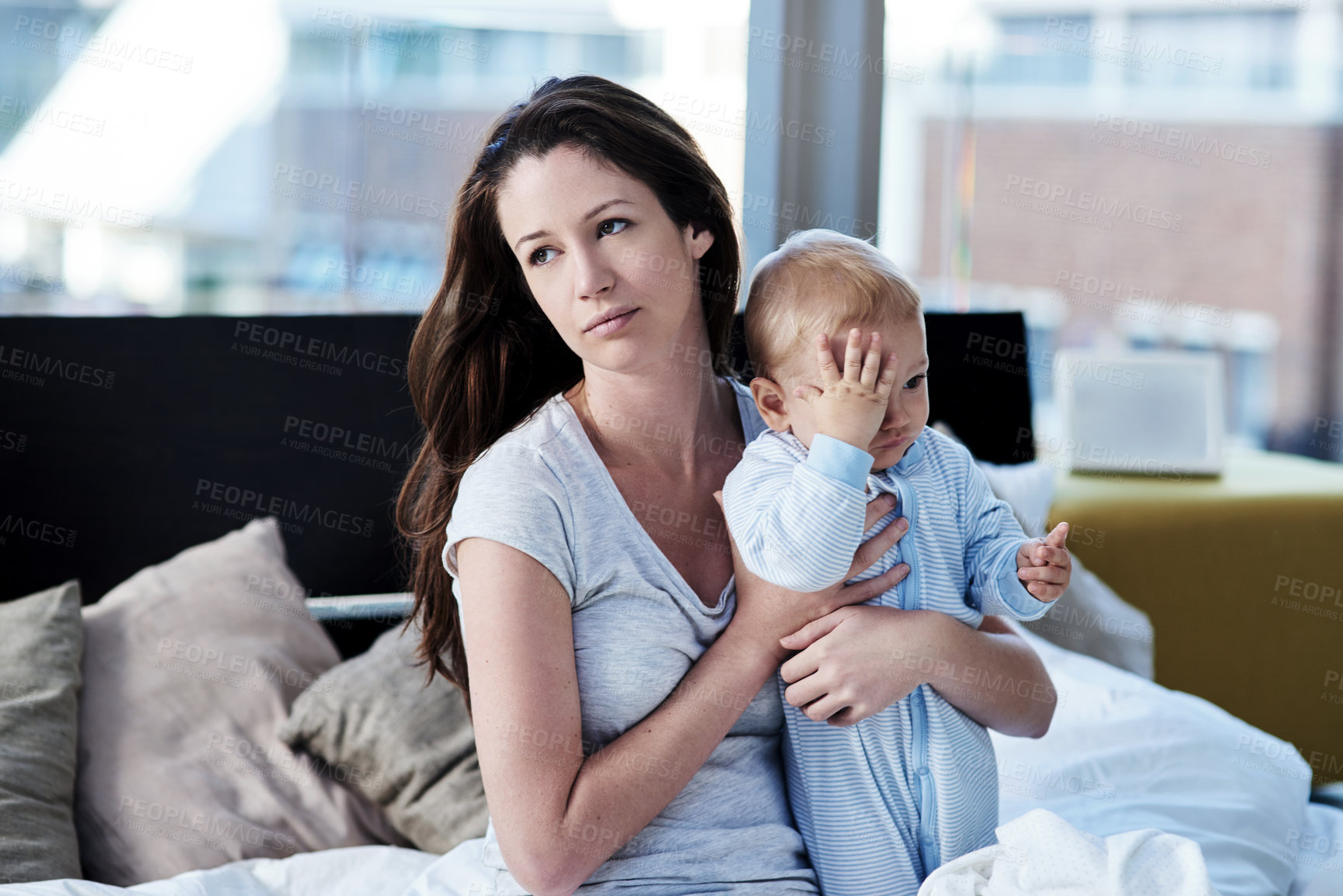 Buy stock photo Shot of a mother and her baby boy at home 