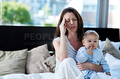 Buy stock photo Shot of a mother and her baby boy at home 