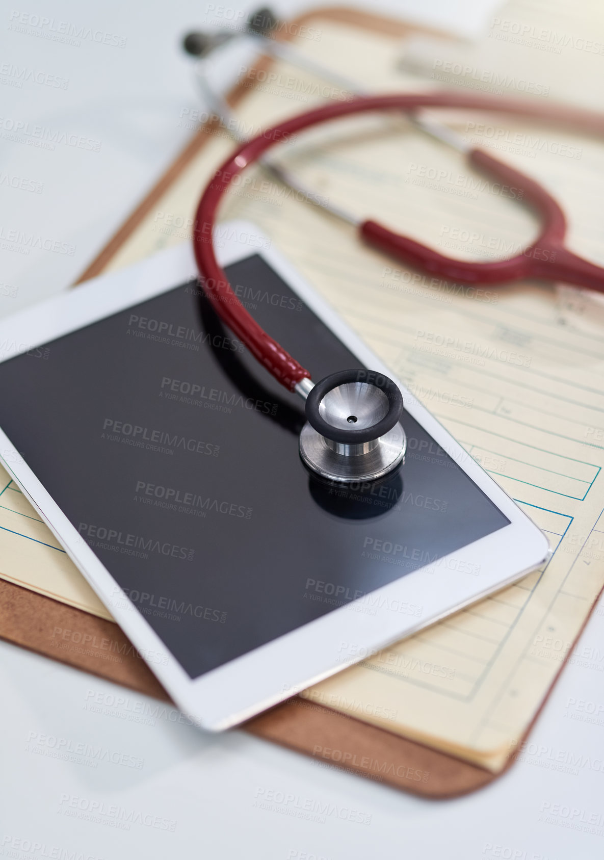 Buy stock photo Hospital, clinic and tablet with stethoscope on desk for medical website, telehealth and research. Healthcare, cardiology and digital tech, equipment and clipboard for online consulting service