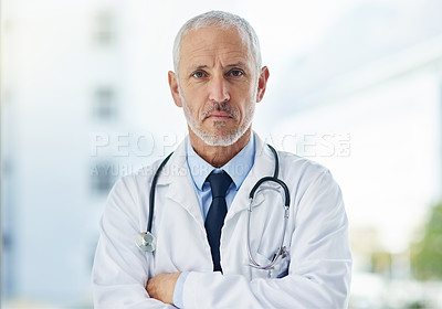 Buy stock photo Doctor, serious and portrait of mature man in a hospital at a cardiology clinic with arms crossed. Professional, medical employee and stethoscope with healthcare, wellness and cardiologist consultant
