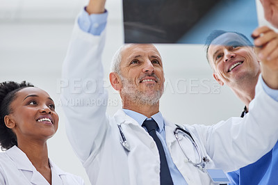 Buy stock photo Hospital, team and doctors checking x ray results for diagnosis, advice or consultation with smile. Healthcare, radiology and medical scan review with professional man, woman and nurse at clinic.