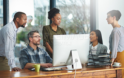 Buy stock photo Shot of businesspeople working together in the office 