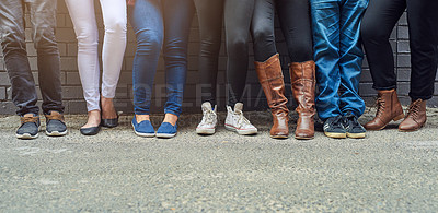 Buy stock photo People, legs and shoes in row with against wall for fashion, style and outfit in streets of New York. Group, friends and together with footwear for trends, casual wear and chill or relax outdoor