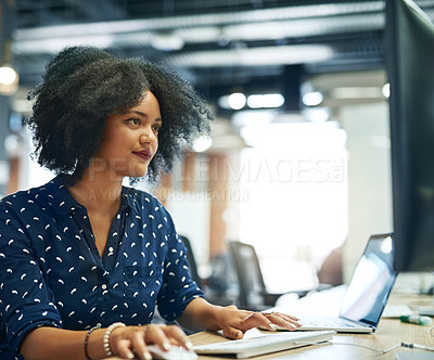 Buy stock photo Shot of a young female designer working in her office