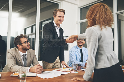 Buy stock photo Shot of businesspeople shaking hands during a job interview in an office