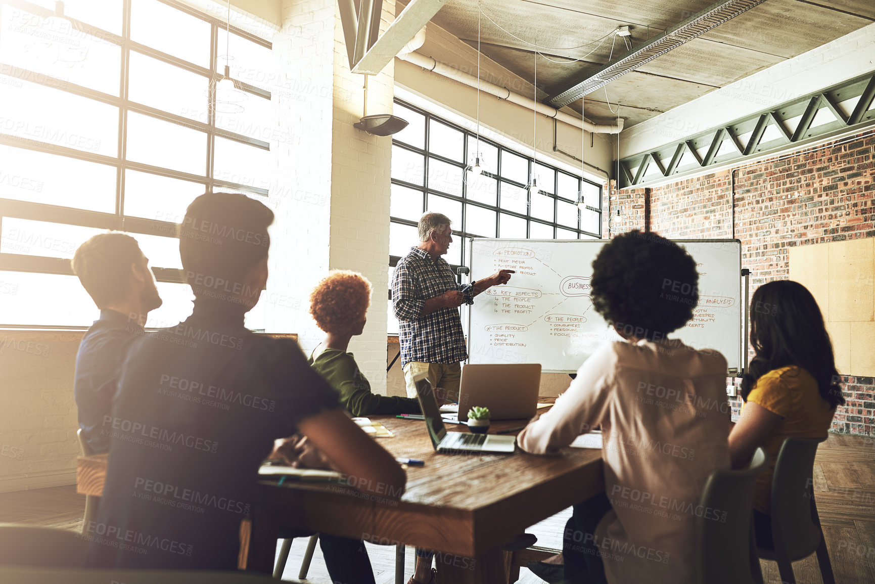 Buy stock photo Man, board and pointing for business plan at meeting with team, discussion and mindmap for planning at company. People, leader and speaker with strategy for growth, development and steps at agency