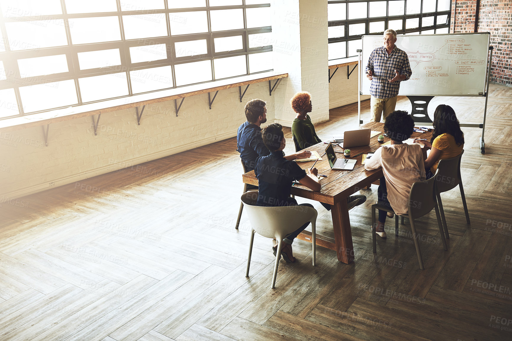 Buy stock photo Man, whiteboard and presentation for business strategy at meeting for team, feedback or mindmap with training at job. People, group and mature speaker with review, question and diversity in office