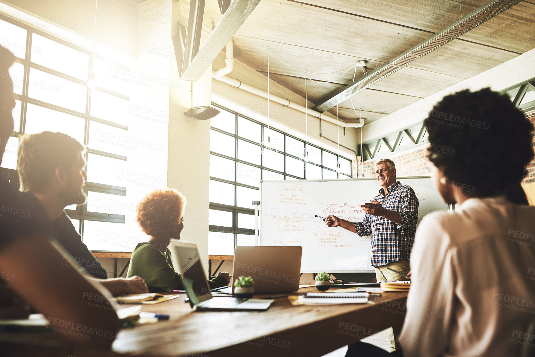 Buy stock photo Mature man, whiteboard and pointing for business plan at meeting for team, discussion and mindmap for planning. People, leader and speaker with strategy for growth, diversity and listening at agency