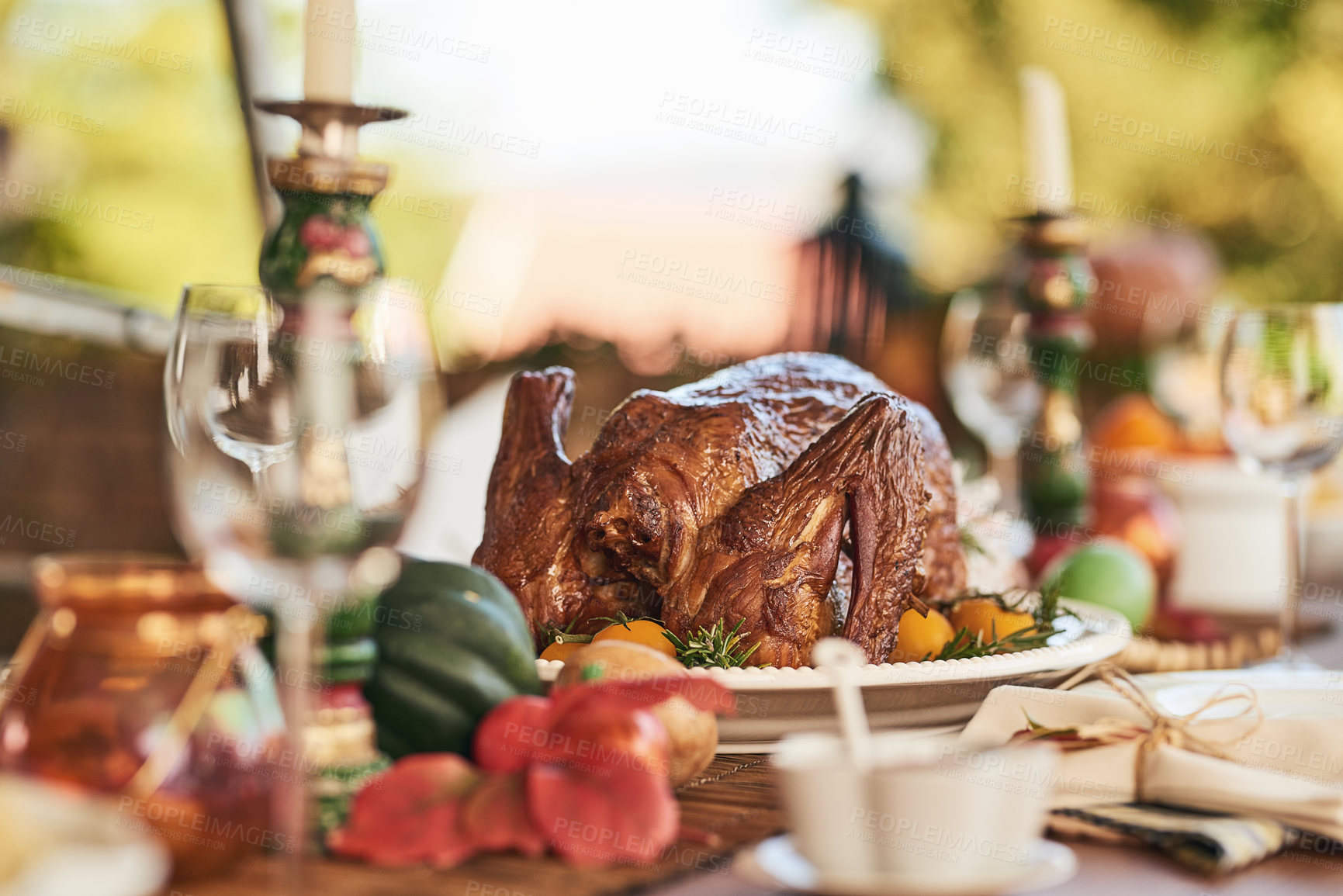 Buy stock photo Thanksgiving turkey, food and table set for lunch outdoors with wine glasses. Champagne glasses, fine dining, and delicious healthy chicken for party, buffet or celebration with luxury meal outside.