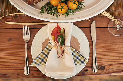 Buy stock photo Christmas, napkin and tableware in a dining room at a party for a festive celebration or event. Empty room, wood table and top view of table set with cutlery for a xmas lunch with decoration in house