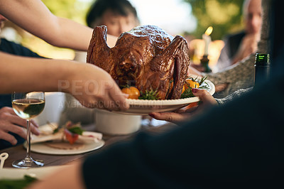 Buy stock photo Thanksgiving, food and party with a roast chicken on a table during a celebration or gathering of family together. Hands, closeup and turkey with a group eating or enjoying a meal while bonding