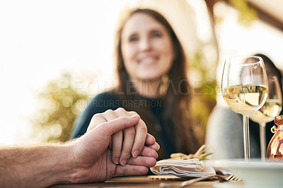 Buy stock photo Couple, dinner and holding hands to celebrate love, support and marriage together outdoor. Romance date, woman and lunch with man for quality time, happy celebration or bonding at restaurant outside