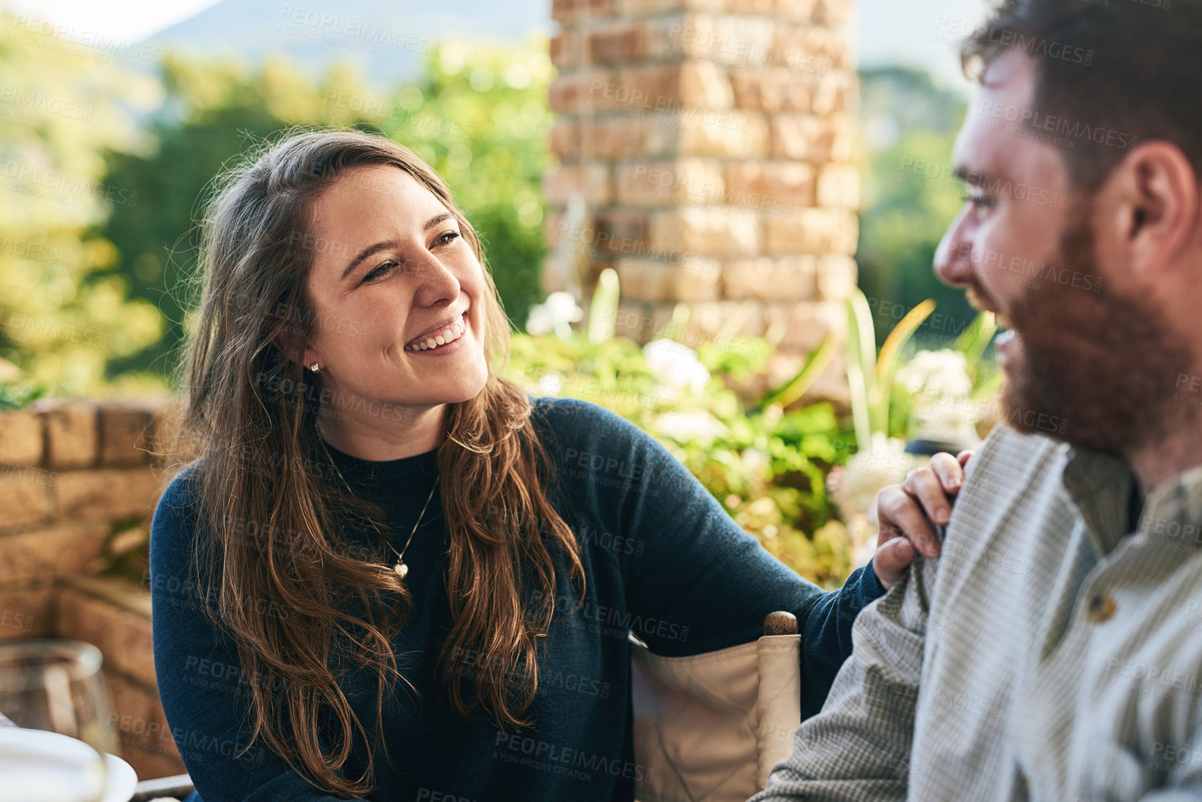 Buy stock photo Happy, love and couple on a patio, smile and relax, laughing and bonding with joke and conversation outside. Family, woman and man enjoying relationship, quality time and a quiet day in a yard
