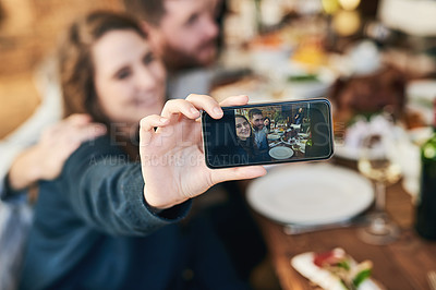 Buy stock photo Couple, family lunch and phone selfie in home at dinner table for thanksgiving celebration memory. Festive fine dining, love and man and woman take picture with mobile smartphone for social media.