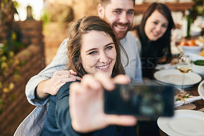 Buy stock photo Friends, selfie and dinner with party and celebration, woman holding smartphone for photo and Christmas or Thanksgiving dinner party. Happy, celebrate and food, having meal together and smile.