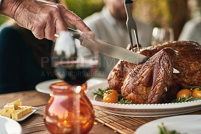 Buy stock photo Hands, food and man with turkey on thanksgiving, lunch and meal at table with hungry people celebrate tradition. Family, chicken and hand prepare meat for social gathering, holiday and family reunion