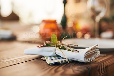 Buy stock photo Closeup, dinner table and setting with a napkin and ties to celebrate with a festive meal or food. Holiday, dining table and dish for a dinner or lunch with an empty bokeh background with nobody