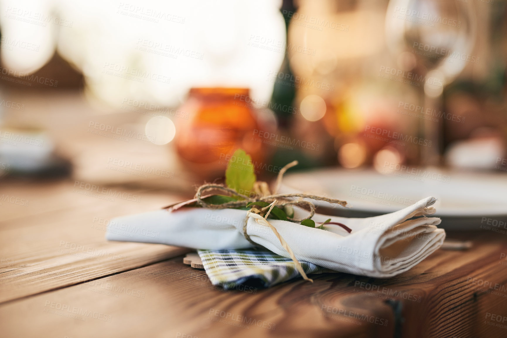 Buy stock photo Closeup, dinner table and setting with a napkin and ties to celebrate with a festive meal or food. Holiday, dining table and dish for a dinner or lunch with an empty bokeh background with nobody