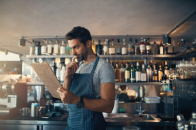 Buy stock photo Man in restaurant, checklist on clipboard and inventory check, small business and entrepreneur in hospitality industry. Male owner reading list, think and cafe franchise with admin and stock taking