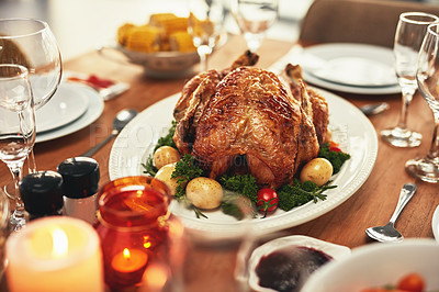 Buy stock photo Thanksgiving, turkey and food on a dinner table for a celebration event, feast or holiday season. Christmas, chicken and meal with a roast dish on a wooden surface for hunger or a special occasion