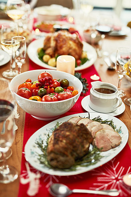 Buy stock photo Christmas, dinner and food on a table for holiday feast with roast, meat and vegetables in home. No people, dining room and festive meal for xmas celebration with decoration on dining table at house.