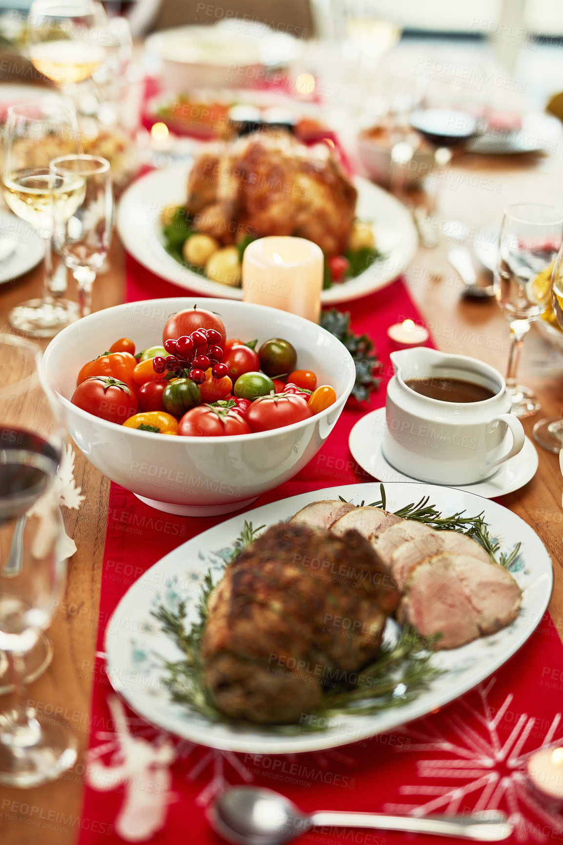 Buy stock photo Christmas, dinner and food on a table for holiday feast with roast, meat and vegetables in home. No people, dining room and festive meal for xmas celebration with decoration on dining table at house.