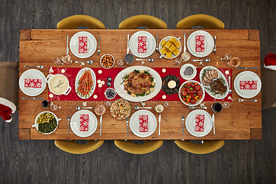 Buy stock photo Dinner, table and Christmas lunch with food at an event from  top view or above of a home dining room for celebration. Chicken, party and holiday or vacation vegetables and meat for fine dining