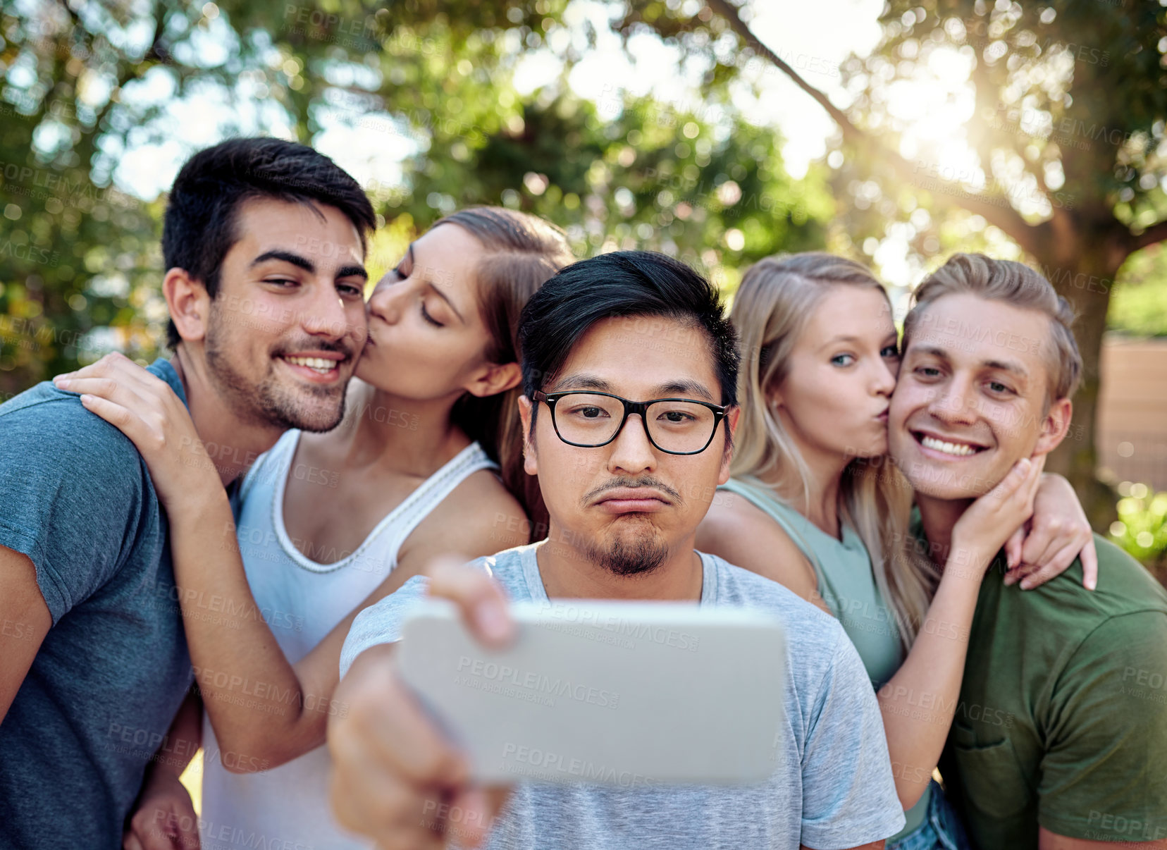 Buy stock photo Selfie, lonely and couple of friends outdoor in nature together for bonding, kissing or profile picture. Love, memory or social media with single man and people in park for photograph of weekend