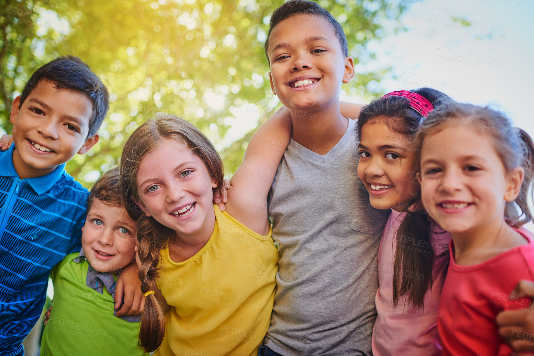 Buy stock photo Shot of a diverse group of children outside