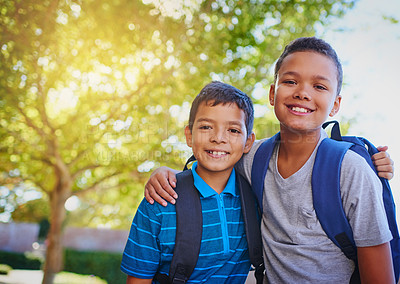 Buy stock photo Shot of two adorable young boys outside