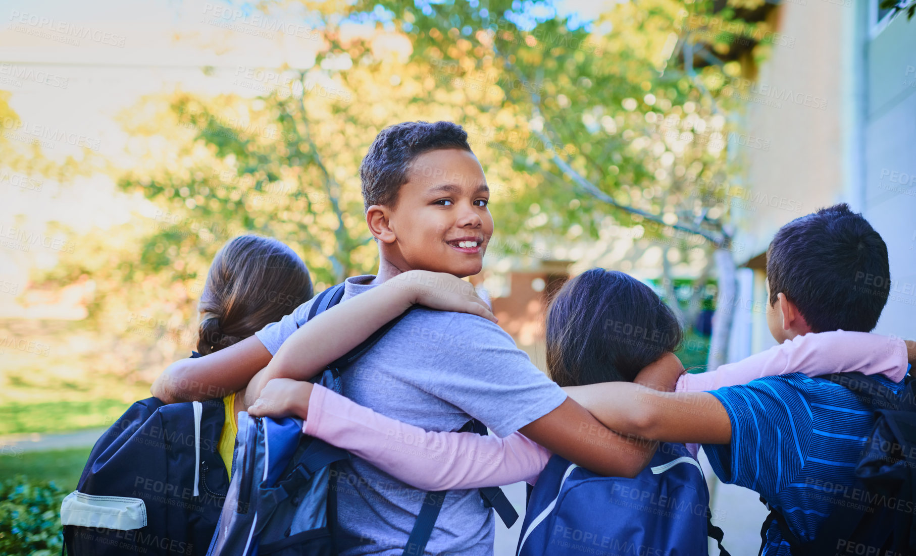 Buy stock photo Rearview shot of a group of children outside