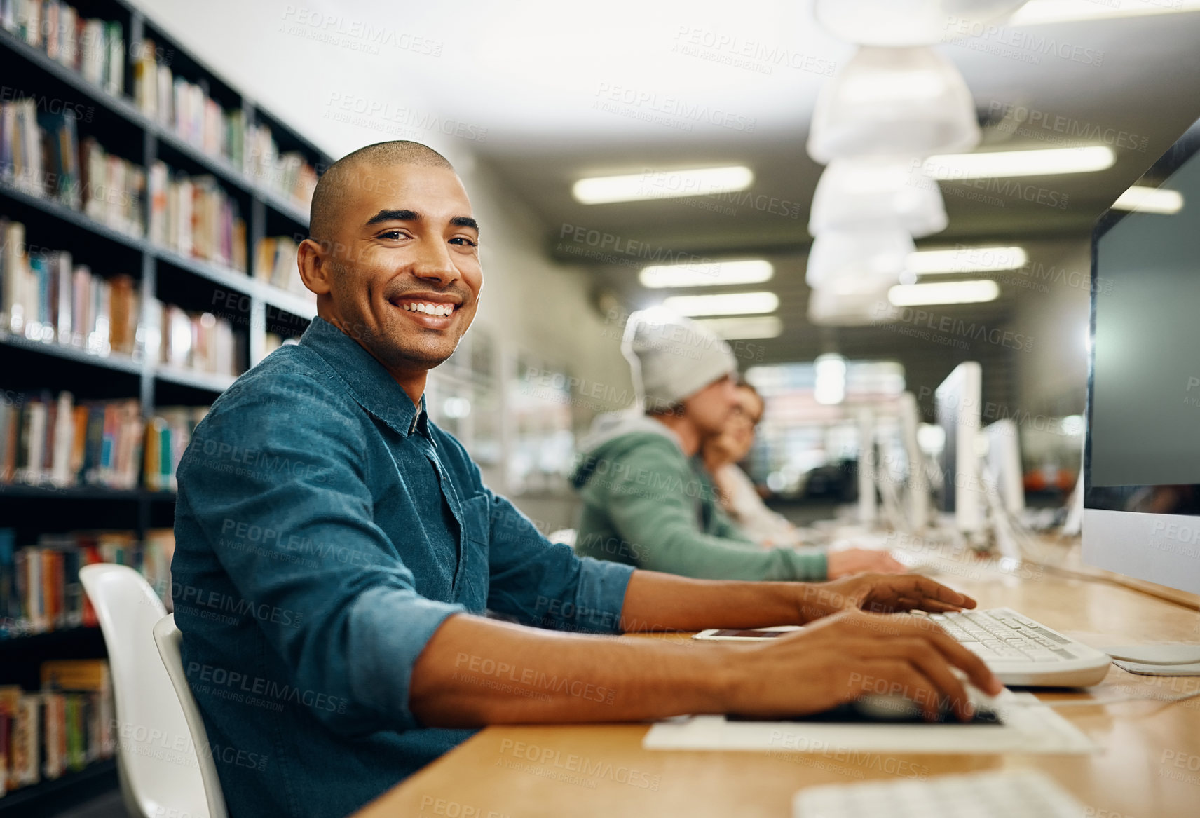 Buy stock photo Student, computer and study in college library for programming test, project and online exam. Black man, school and portrait in university for education, learning and information technology course