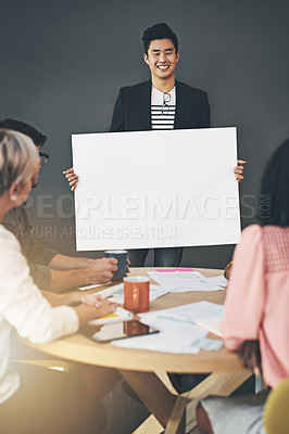 Buy stock photo Casual, creative team doing a fun presentation with a blank card, billboard or poster in a modern office. Happy diverse team working together, sharing an idea or business plan while brainstorming