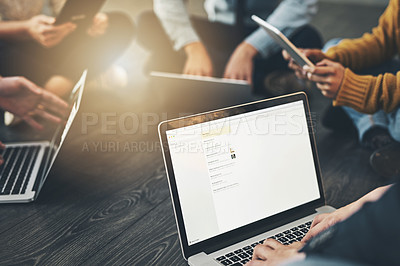 Buy stock photo Shot of a group of unrecognizable people having a meeting inside