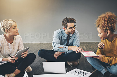 Buy stock photo Shot of a diverse group of creative employees having a meeting inside