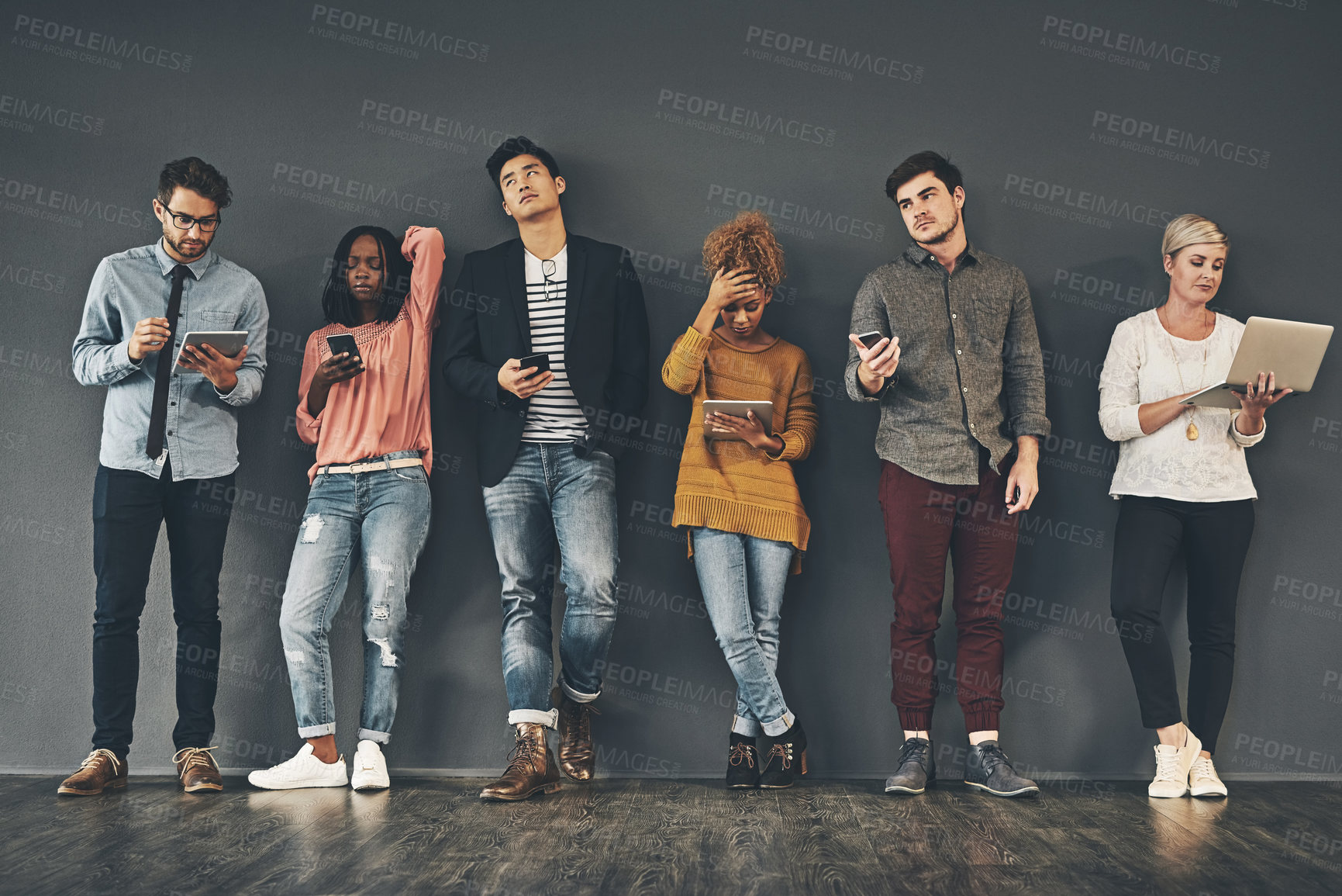 Buy stock photo Studio shot of a diverse group of creative employees social networking inside