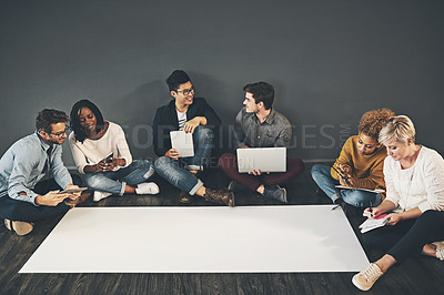 Buy stock photo Studio shot of a diverse group of creative employees having a meeting inside