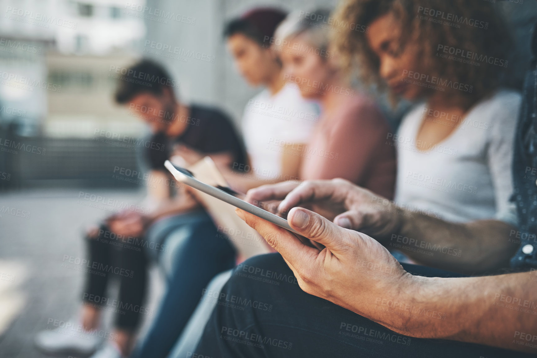 Buy stock photo Shot of a diverse group of people social networking outside