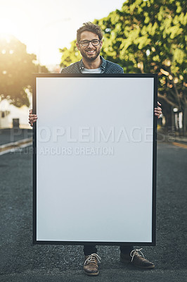 Buy stock photo Happy young man holding copy space poster in the outdoors. Smiling guy with a big placard or sign for message design, advertising and marketing for events or branding in nature background.