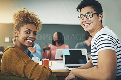 Buy stock photo Portrait of two young designers sitting in an office