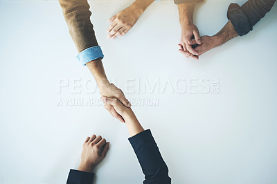 Buy stock photo Handshake, agreement and business people in partnership, support and trust together for business consulting. Above, collaboration and team in negotiation, welcome or deal with witness at table