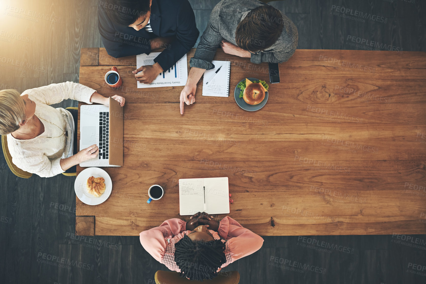 Buy stock photo Laptop, meeting and top view of business people in office with food for teamwork, collaboration and planning. Mockup, corporate and workers with computer, documents and graph for financial report