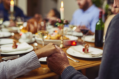 Buy stock photo Prayer, thanksgiving and hand holding with family at table in dining room for holiday, food or worship. Praying, support and gratitude with closeup of people at home for kindness, dinner and love