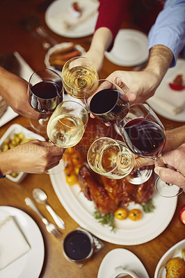 Buy stock photo Closeup shot of a group of people making a toast at a dining table